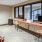 Spacious and well lit business center with ample computers 