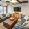 Spacious and well lit clubhouse with plenty of seating and a view of the pool 